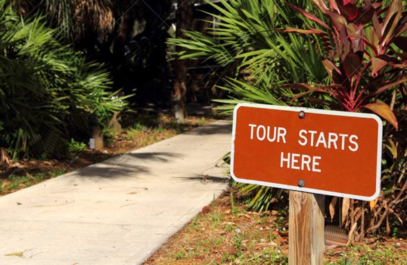 Tour Starts Here Sign