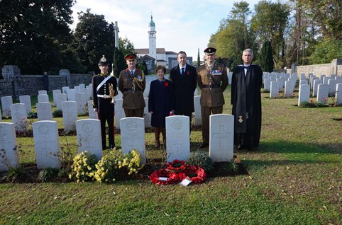 Carol And Gavin Adams (Centre) Standing Behind The Headstone Of Robert Jordan