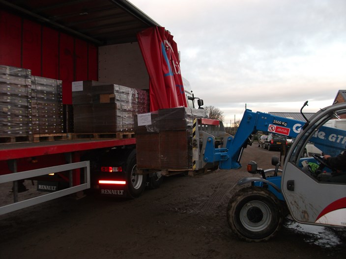 One Of The Early Pallets Being Unloaded