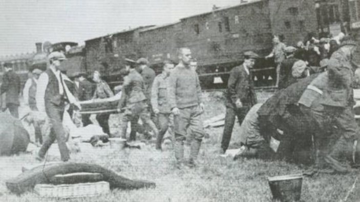 The Men Of The Royal Scots Helping Their Comrades.