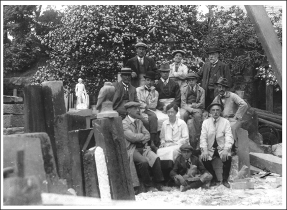 J.H. Morcom –Seated Front Row With Arms Folded