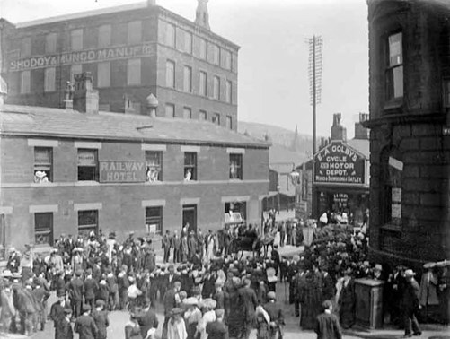 Parade Outside Railway Hotel, Bradford Road, Dewsbury, 1910. Machell Brothers Warehouse Is In The Background.