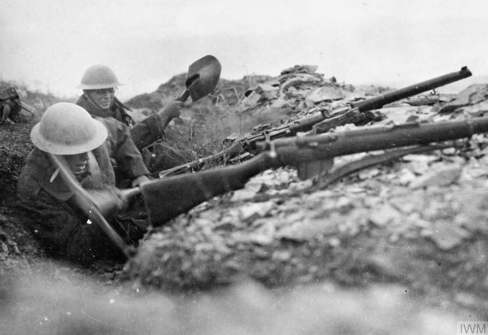 Two British Infantrymen Attempt To Deepen A Trench Using Pick And Shovel In The Rocky Terrain Around Doiran (IWM HU 81087)