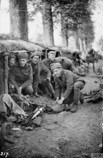 Men Of The 2Nd Battalion, Cameronians (Scottish Rifles), Preparing Battle Kit Outside A Dugout Behind Cellar Farm At 5.15Am On 9 May 1915. (Image Courtesy Of The Imperial War Museum. IWM Q51623.)