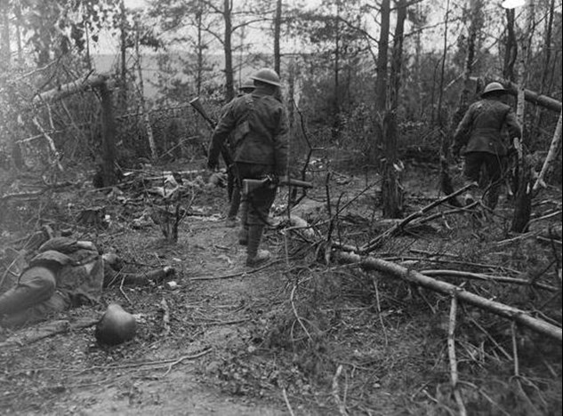 Battle Of Tardenois. Troops Of The 5Th Battalion, Duke Of Wellington's Regiment (62Nd Division) Advancing Through The Bois Du Petit Champ, 22 July 1918. Note A Dead German Soldier On The Left