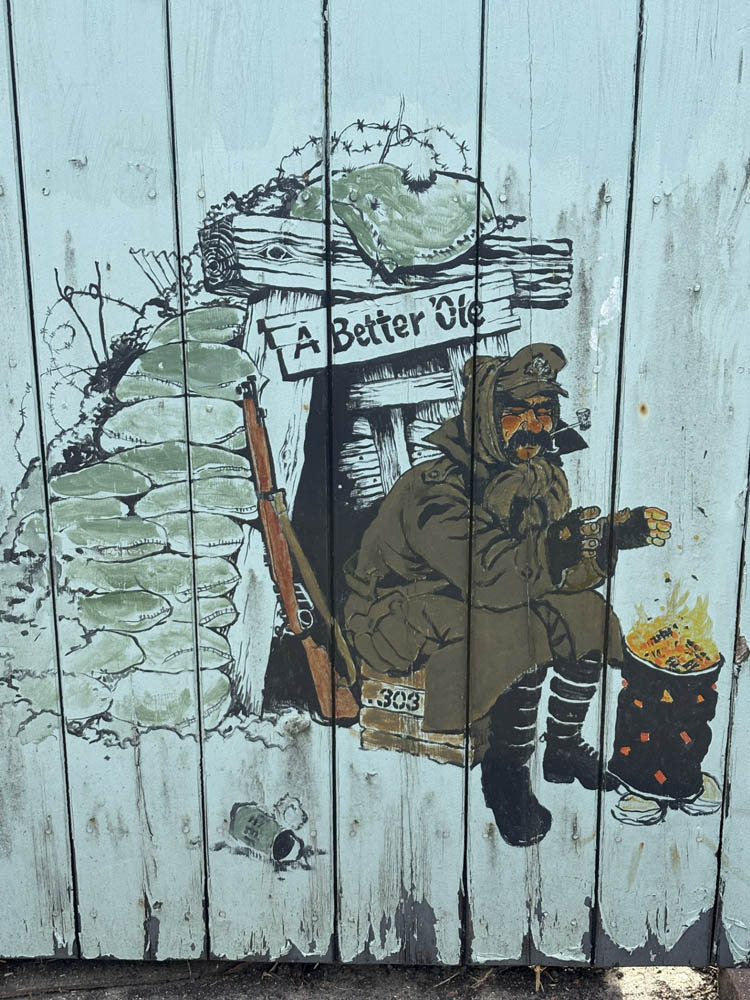 An Image On A Gate Of Bruce Bairnsfather’S ‘Old Bill’