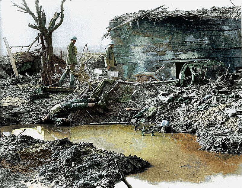 Canadian Soldiers Survey A Destroyed German Bunker.