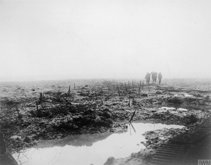 Canadian Stretcher Bearers Carrying A Wounded Soldier Through The Mud Of The Ypres Salient, 1917. © IWM CO 2252