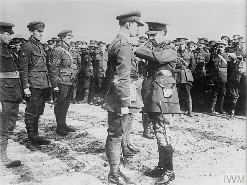 Lieutenant Kent Of The 10Th Battalion, Canadian Expeditionary Force, Being Decorated By Lieutenant General Edwin Alderson With The Military Cross. Near Locre, 9Th March 1916. (IWM Q441)