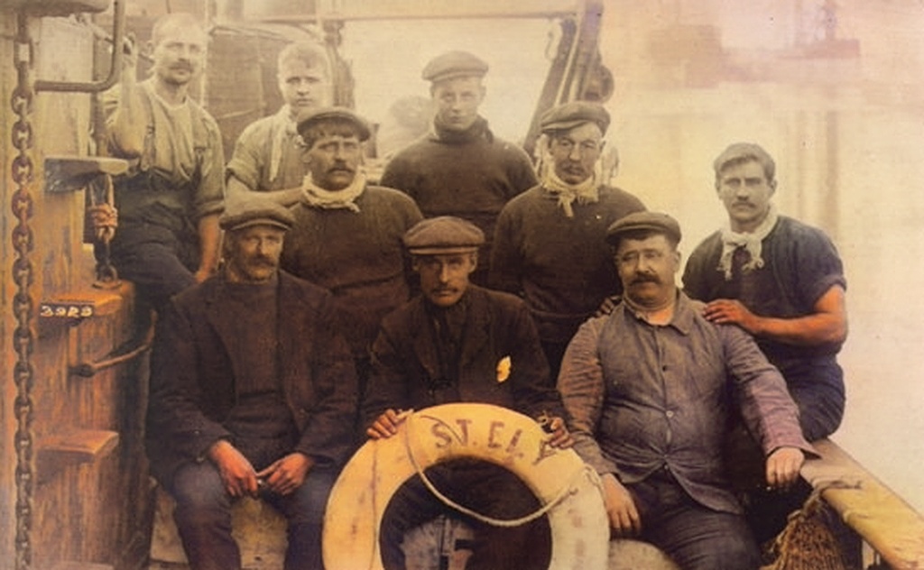 Skipper, William Darby Coates (Senior) Of The Steam Trawler “EARL” On This Occasion Photographed With His Crew On The Trawler 'Ely' Colour